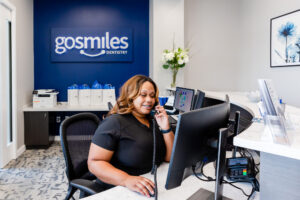 Front desk assistant scheduling a patient at our dental office in Gainesville, VA.