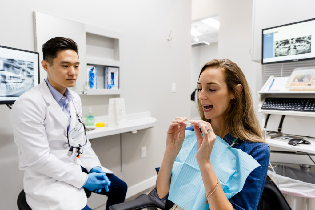 dentist with a patient during treatment for dental sealants and fluoride treatment in Gainesville, VA.